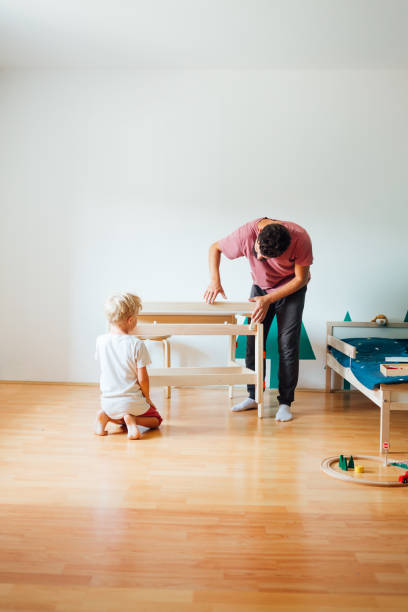 istock Father And Son Working On Carpentry At Home 1308133893