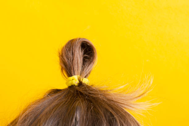 istock The child's head on a yellow background. Abstract background 1308134015