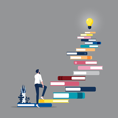 Businessman climb at books stairs with light bulb on top. self development, education, practice. self-management