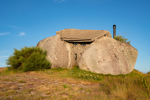 Fafe, Portugal - July 18, 2019 : Beautiful stone Penedo Boulder House in Fafe, in Portugal