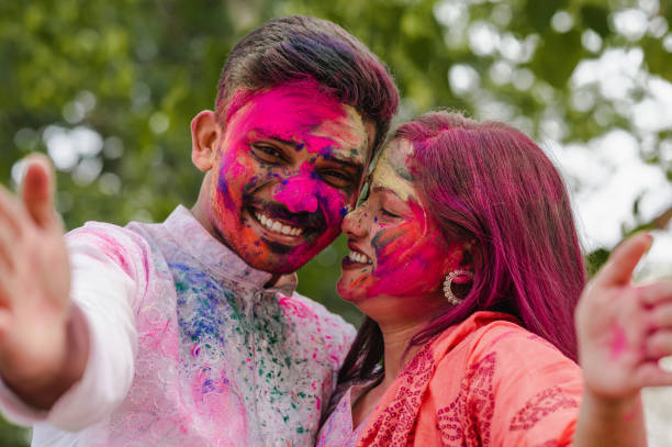 istock Young couple taking selfie while enjoying Holi Festival 1308140722