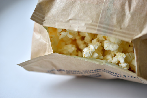 Microwave popcorn on a white background in a bag