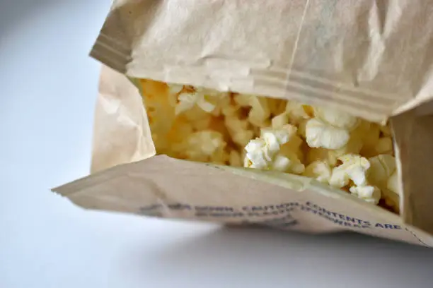 Photo of Microwave popcorn on a white background in a bag