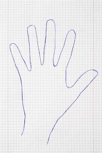 Photography of Hand shape drawn with pen on note pad