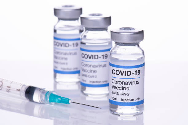 istock 3 coronavirus vaccine vials and hypodermic syringe needle 1308143685