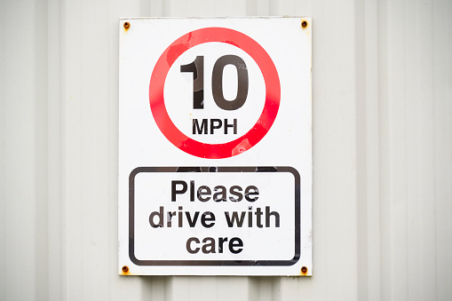 Ten mph construction building site speed safety sign England uk
