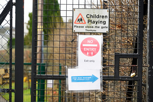 Children Playing Please Close Gate Sign at Playground UK