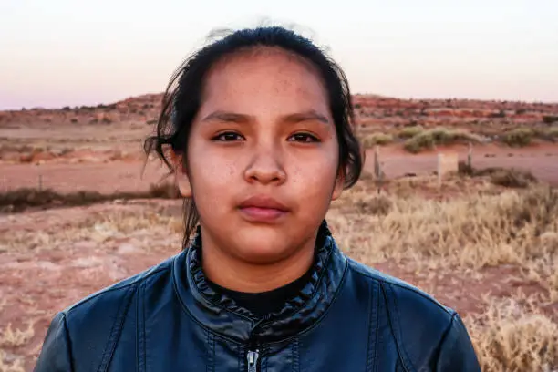 Photo of A Close Up Portrait Of A Navajo Native American Young Woman Near Her Home In Monument Valley, Utah