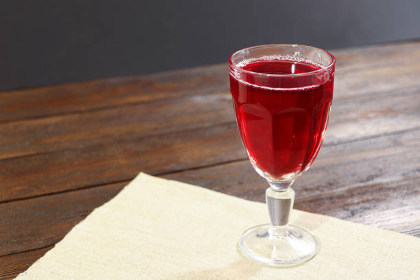 istock Glass of red wine on a wooden table. 1308162011