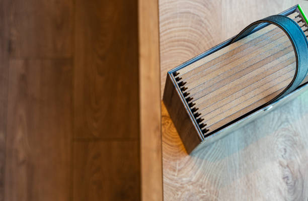 istock Close up view of laminate plank samples on parquet floor, High angle view 1308162130