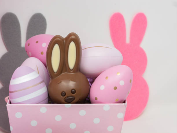 istock Chocolate Easter bunny hidden in a pink basket 1308164200