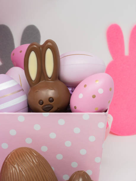 istock Chocolate Easter bunny hidden in a pink basket 1308164202