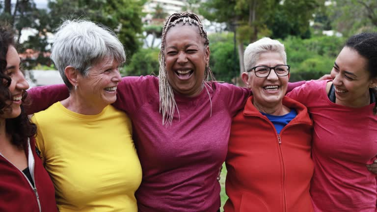 Happy multi generational women having fun together - Multiracial friends after sport workout outdoor