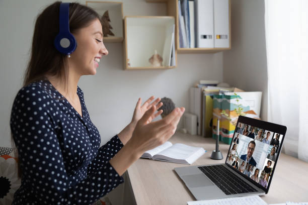 istock Smiling female employee talk on video call with colleagues 1308167362