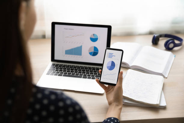 istock Close up of woman study finances using devices 1308167368