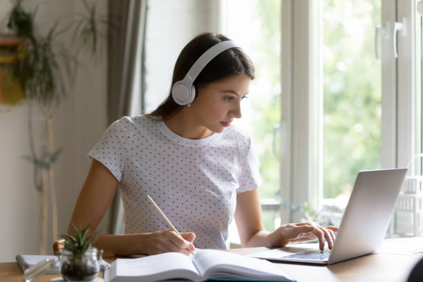 istock Millennial female student study online on laptop 1308167397