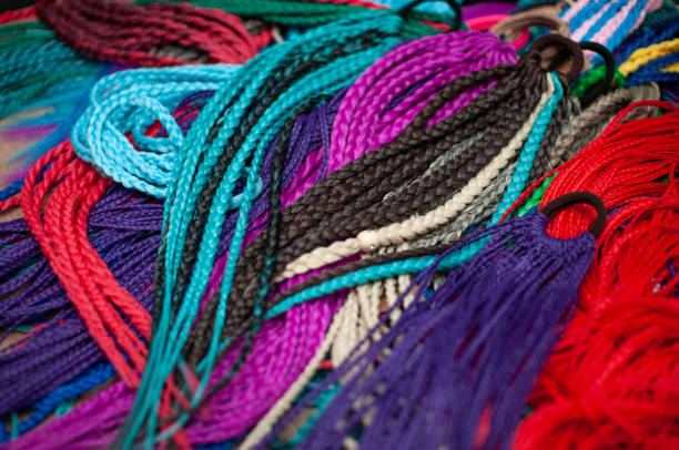 istock Colored braids on an elastic band for hair 1308168961