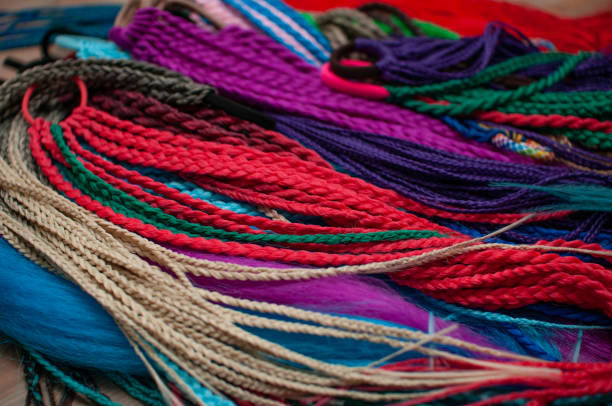istock Colored braids on an elastic band for hair 1308169008