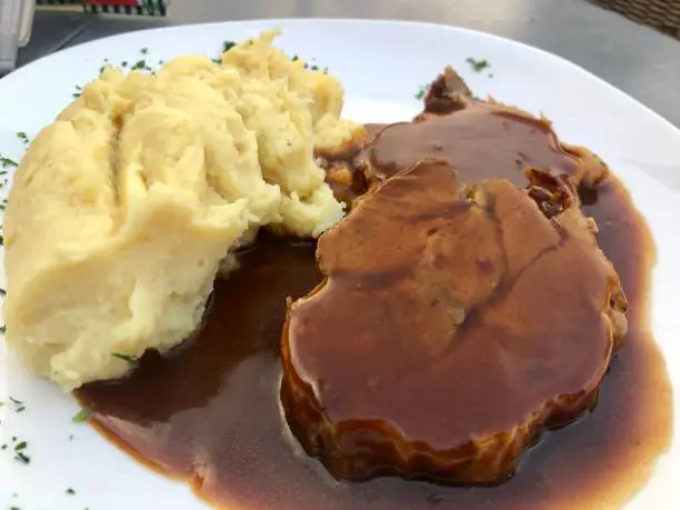 Sauerbraten, a traditional German roast of heavily marinated meat with mashed potatoes