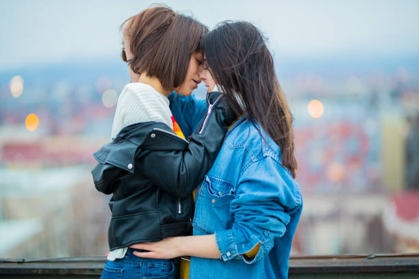 Young lesbian couple kissing stock photo