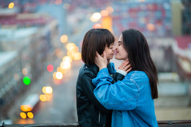 istock Lgbt couple kissing on the rooftop 1308170849