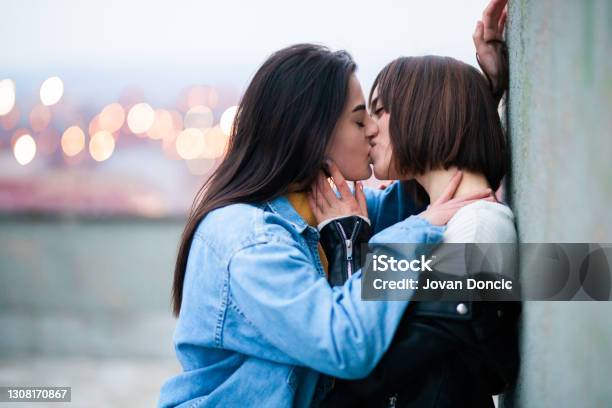 Young Female Lgbt Couple Kissing Stock Photo - Download Image Now - Kissing, Teenage Girls, Lesbian