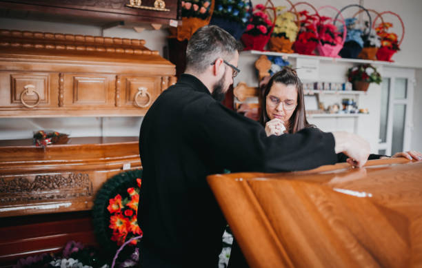 istock Undertaker showing coffins to a widow 1308171590