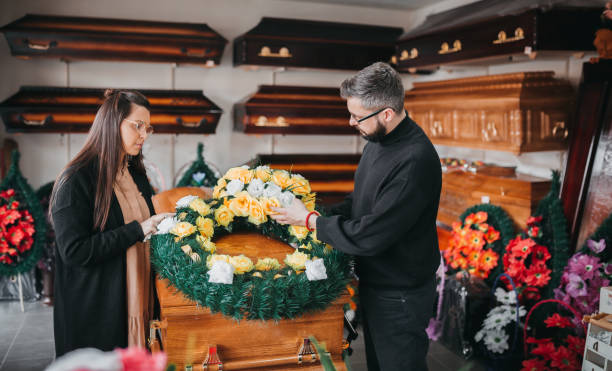 A woman is looking at things for a funeral