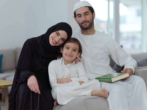 istock Young muslim family reading Quran during Ramadan 1308176272