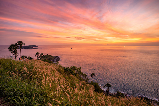 Landscape of Promthep cape in evening with beautiful dramatic twilight sky (Phuket, Thailand)