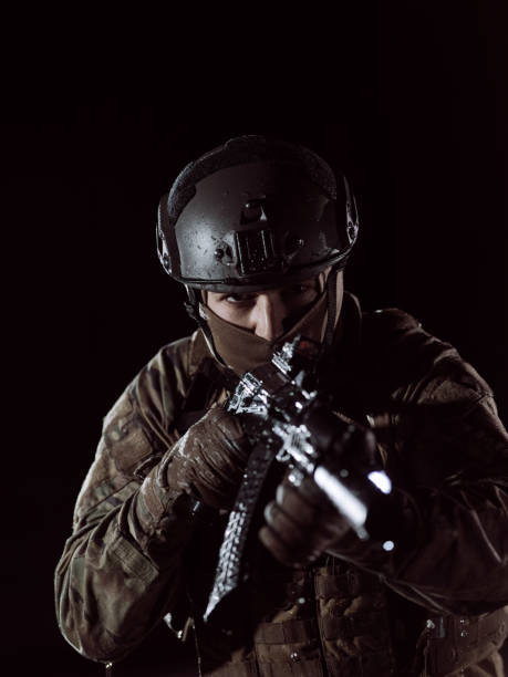 istock soldier with full combat gear in night mission 1308183086