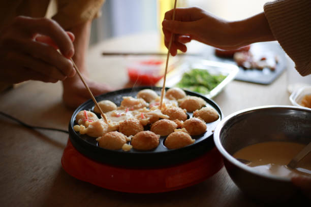 istock A couple making takoyaki at home 1308183334