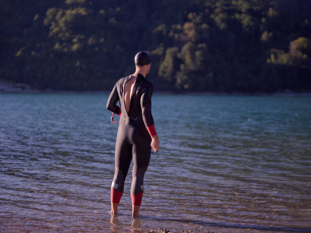 istock triathlete swimmer portrait wearing wetsuit on training 1308184019