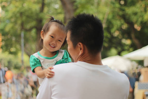 istock a Asian girl holding her father. 1308187044