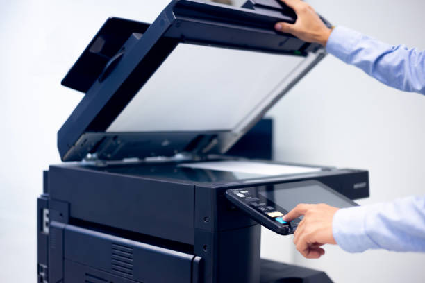 istock Bussiness man Hand press button on panel of printer, printer scanner laser in office copy machine supplies start concept. 1308192432