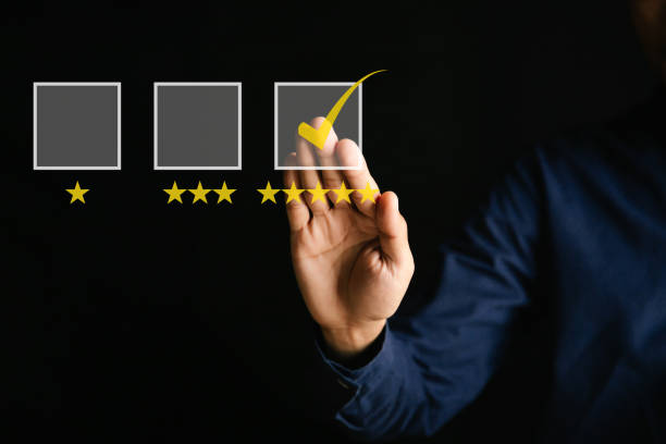 istock Customer service and Satisfaction concept ,Businessman are touching the virtual screen on the happy Smiley face icon to give satisfaction in service. 5-star rating very impressed. 1308193028
