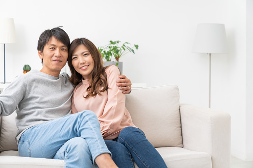 Asian couple at modern home