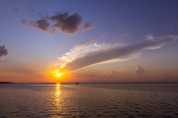 istock The ocean beach set with beautiful cloud and sun rays. 1308198164