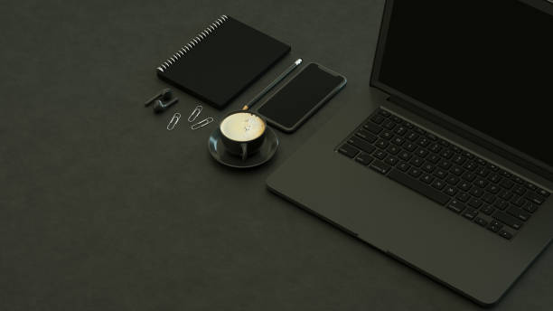 istock Blank Screen Laptop and Smartphone on Black Background 1308200024