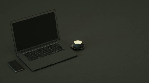 istock Blank Screen Laptop and Smartphone on Black Background 1308200033