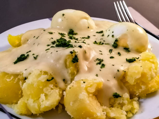 istock Mustard eggs with potatoes and sauce 1308210967