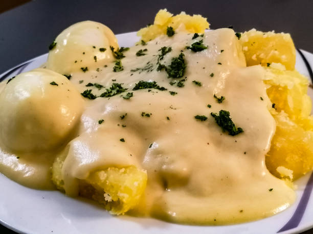 istock Mustard eggs with potatoes and sauce 1308210979