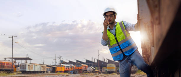 istock Railway engineer holding a walkie-talkie on the train. 1308215048