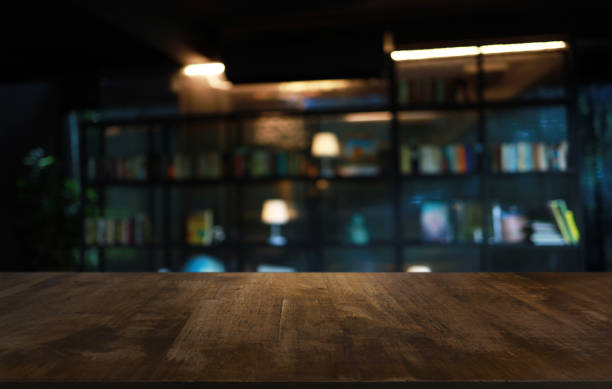 istock Wood Table Top in Blur Background room interior with empty copy space. 1308216797
