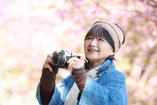 Senior woman taking a picture