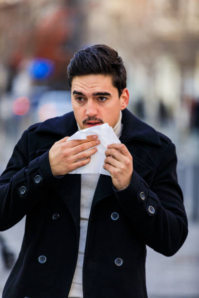 istock Young businessman is having allergy. He is blowing nose. 1308219087