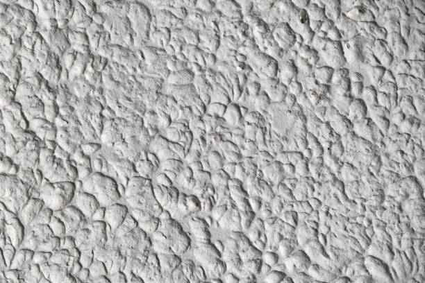 istock textured stucco background with scratches. uneven plaster backdrop 1308219974