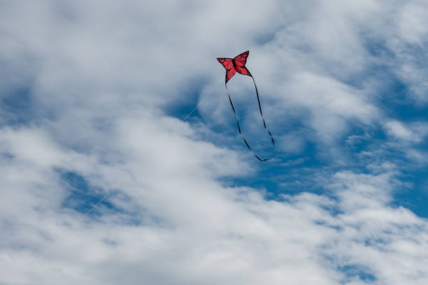 istock Colorful Kites flying over the sky 1308220972