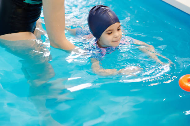 istock Kid try catch toy in pool 1308222961
