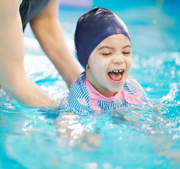 istock Having fun child swim in pool 1308222964